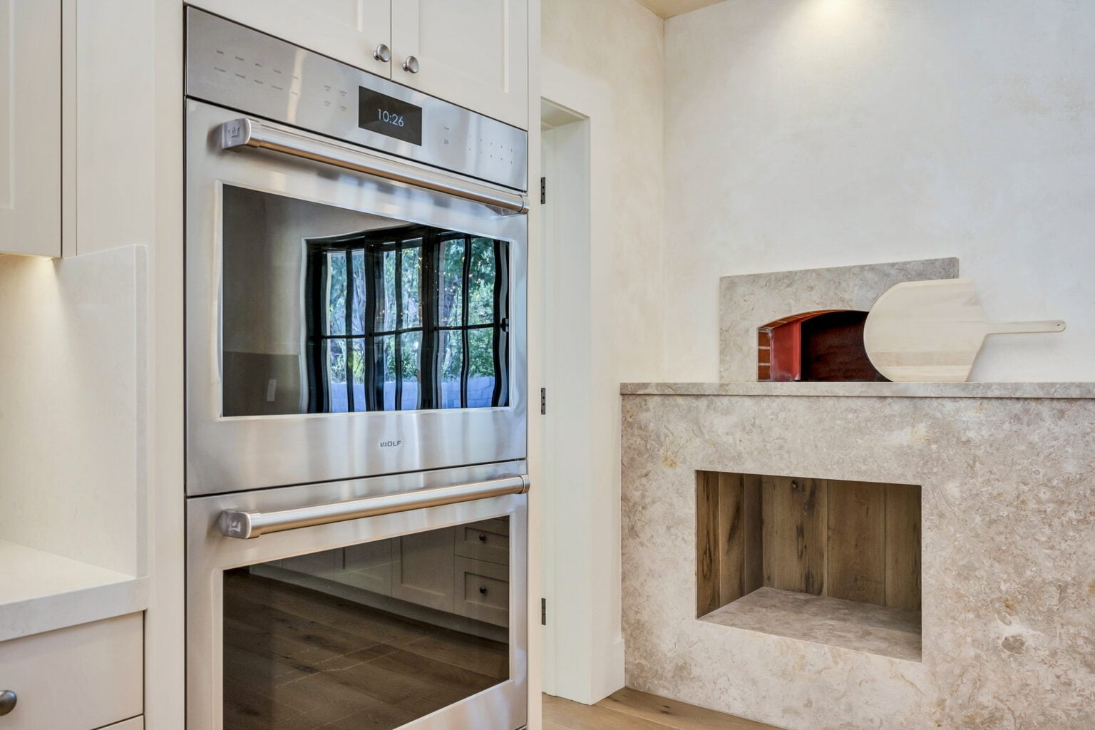 Electric and fire ovens in the corner of the kitchen of Santa Rosa Hills Custom Transitional Rebuild