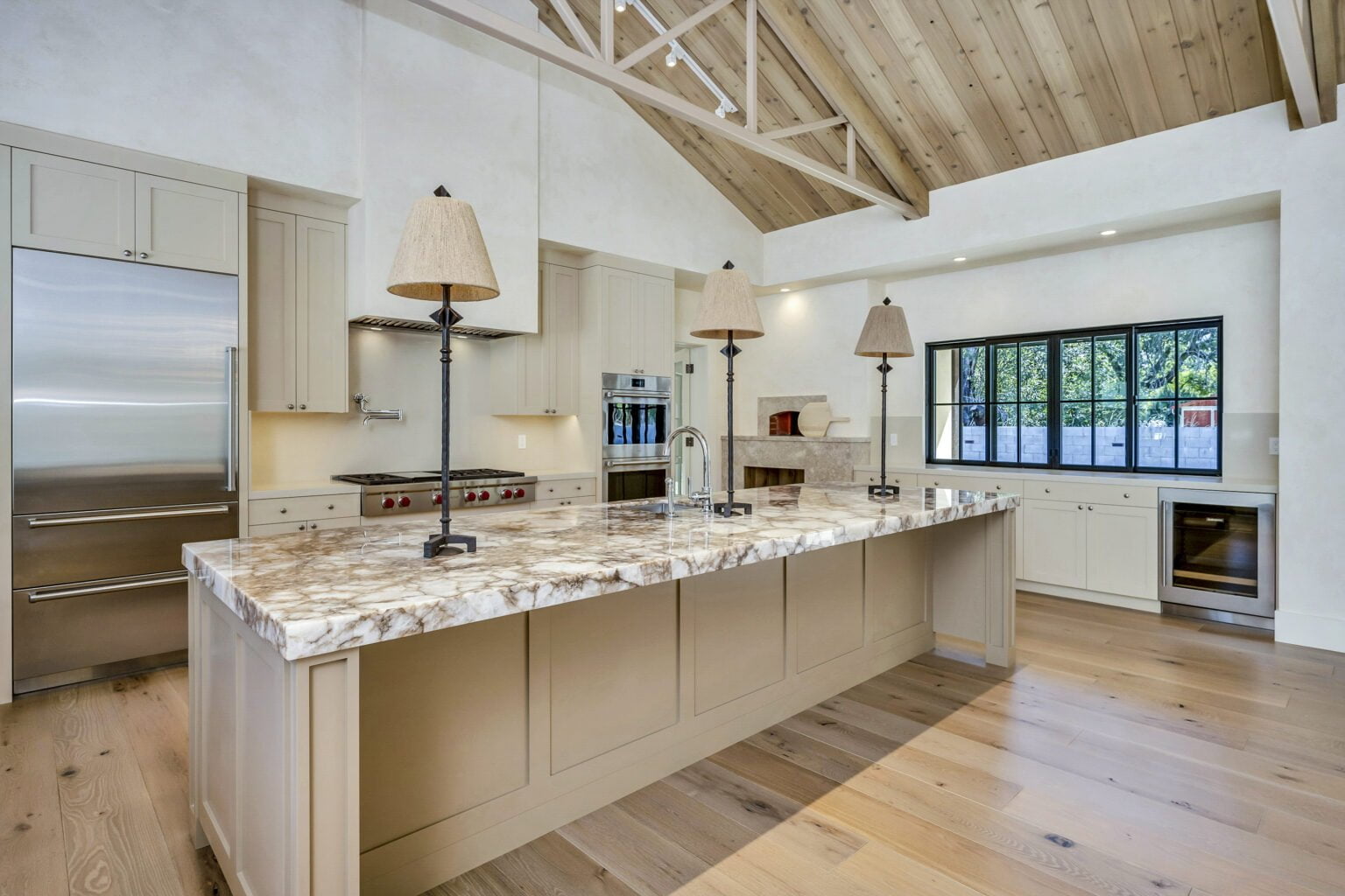Large island in the center of the kitchen of Santa Rosa Hills Custom Transitional Rebuild